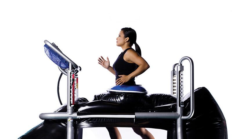 Woman running on the anti-gravity treadmill.