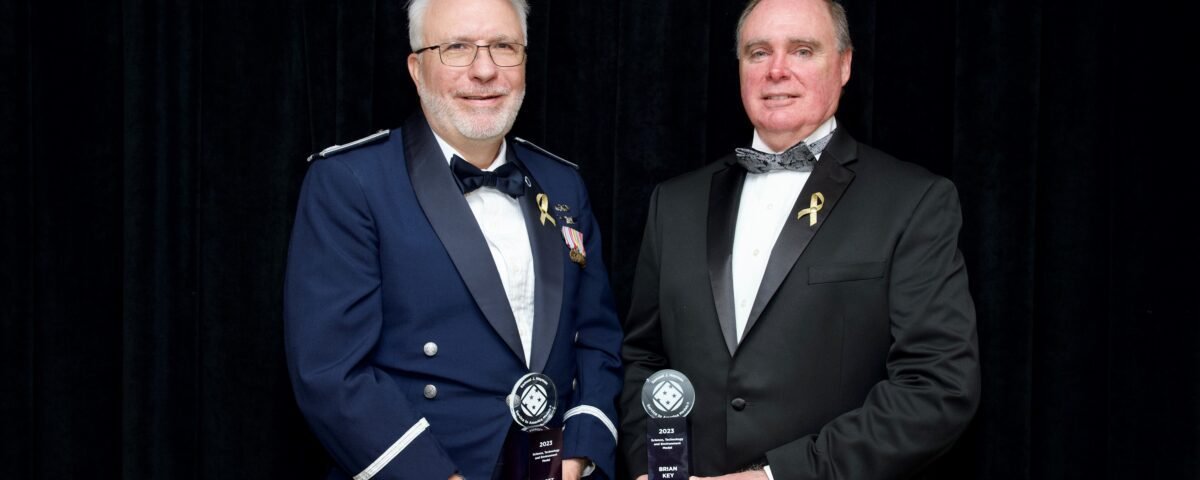 Scott Bellamy, left, and Brian Key, right, stop for a photo moments after receiving the Samuel J. Heyman Service to America Medals. Bellamy and Key accepted on behalf of the entire DART team during a ceremony at the John F. Kennedy Center for Performing Arts in Washington on Oct. 17.