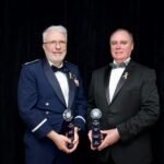Scott Bellamy, left, and Brian Key, right, stop for a photo moments after receiving the Samuel J. Heyman Service to America Medals. Bellamy and Key accepted on behalf of the entire DART team during a ceremony at the John F. Kennedy Center for Performing Arts in Washington on Oct. 17.