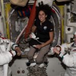 NASA astronaut Jasmin Moghbeli (center) assists astronauts Andreas Mogensen (left) from ESA (European Space Agency) and Loral O'Hara (right) from NASA as they try on their spacesuits and test the suits' components aboard the International Space Station's Quest airlock in preparation for an upcoming spacewalk.