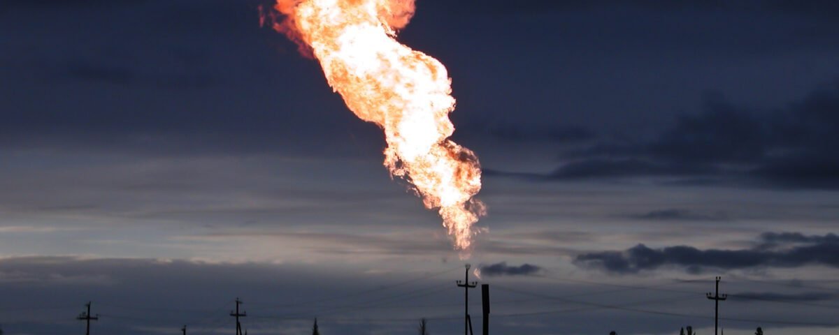 Picture of burning oil gas flare outdoors