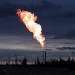 Picture of burning oil gas flare outdoors